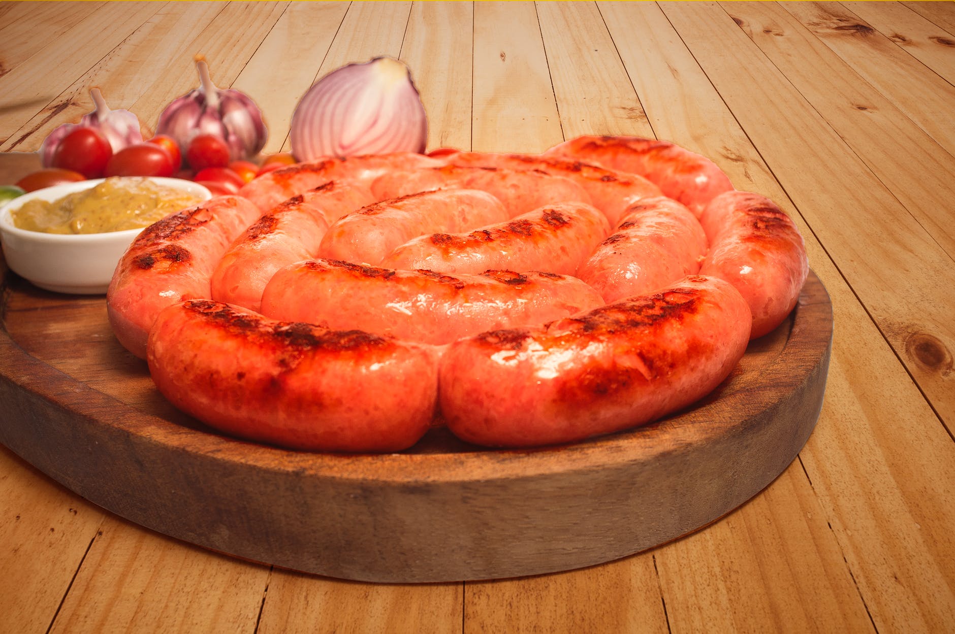 sausages on top of brown wooden board